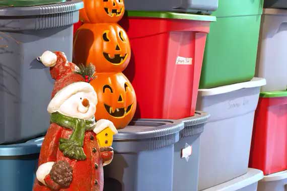 Bins storing Christmas and Halloween decorations